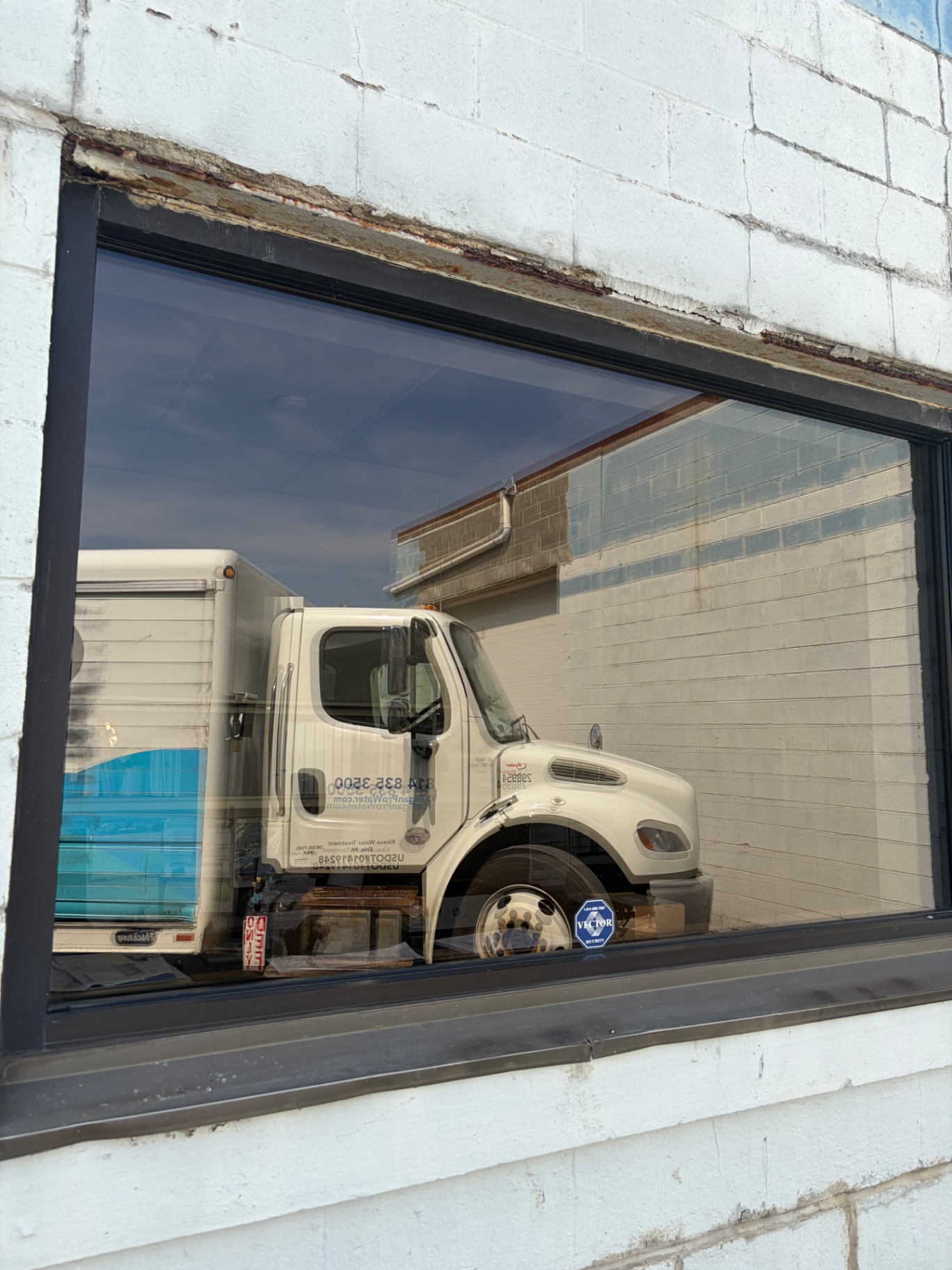 Commercial storefront window cleaned in Erie