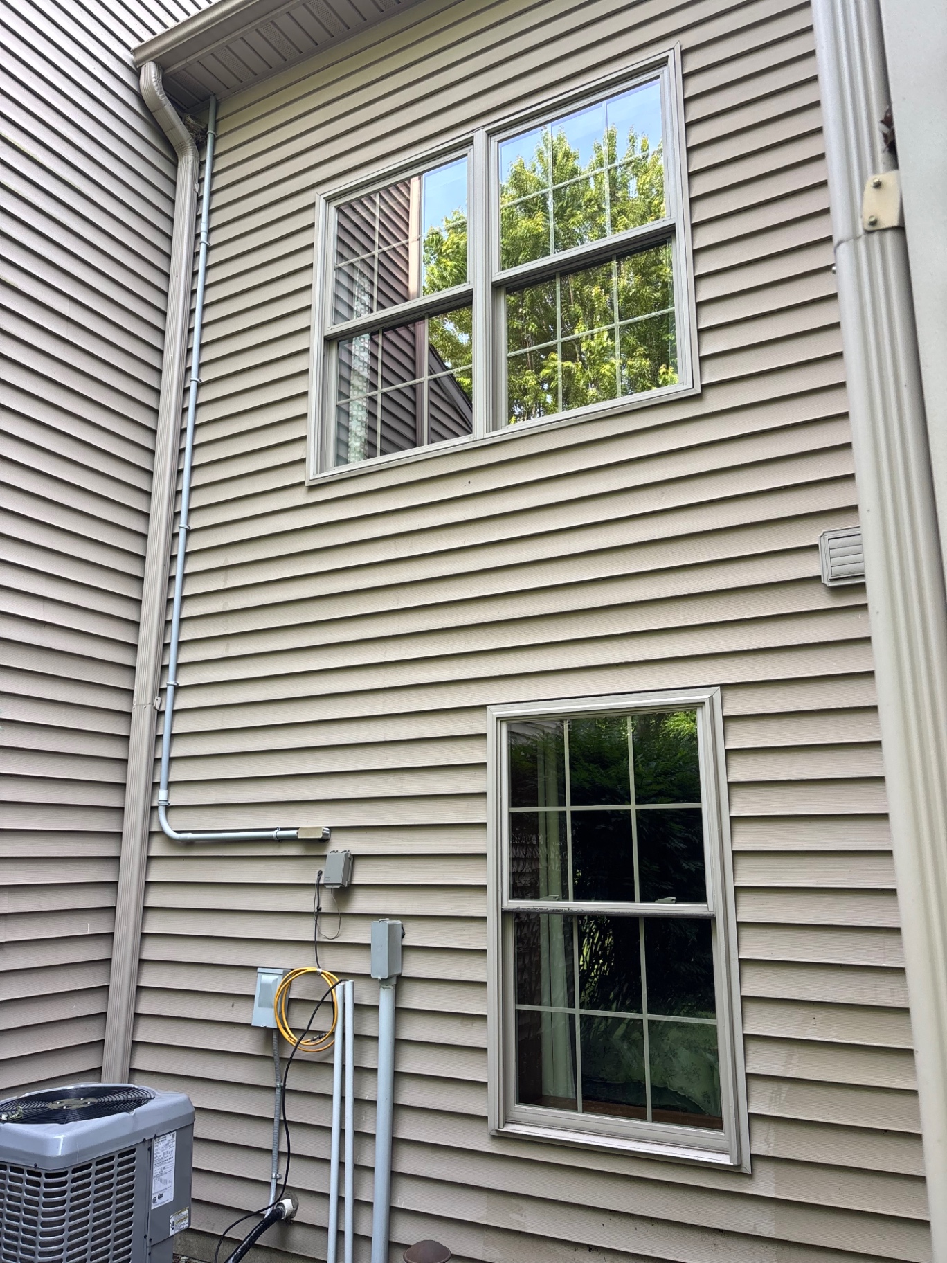 Two-story home windows cleaned in Millcreek area