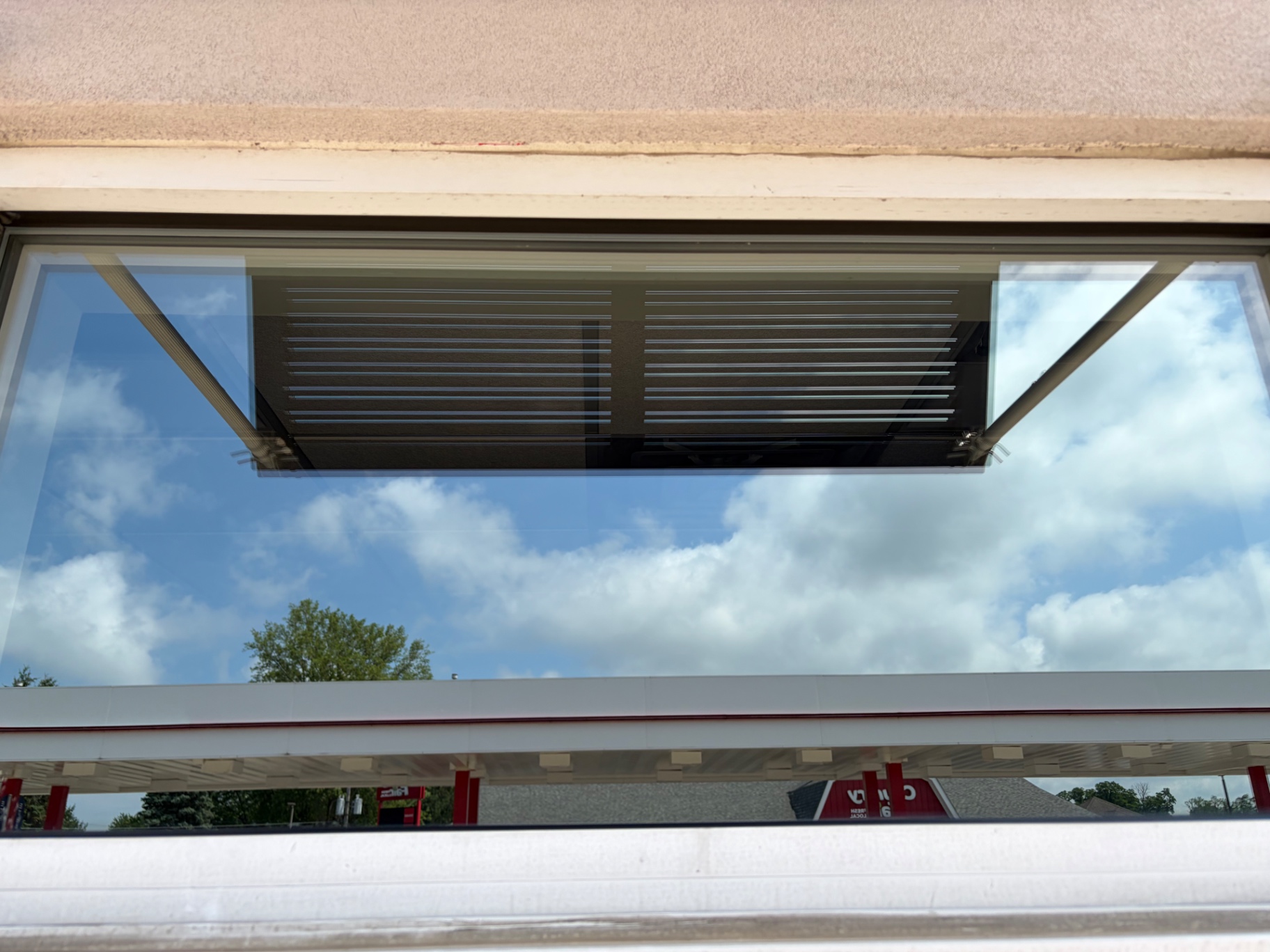 Crystal clear commercial window with sky reflection