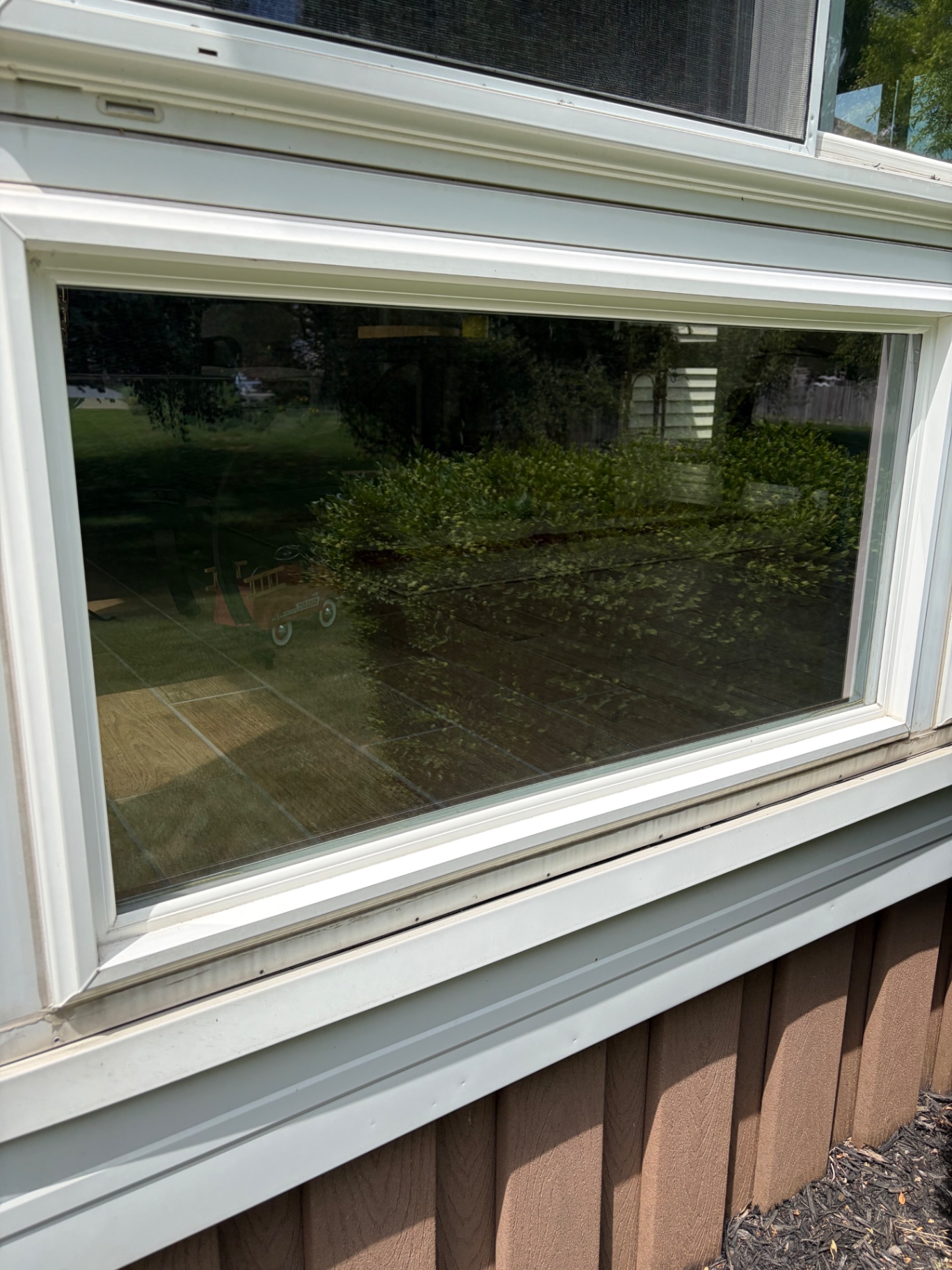 Detail of clean picture window with clear reflection